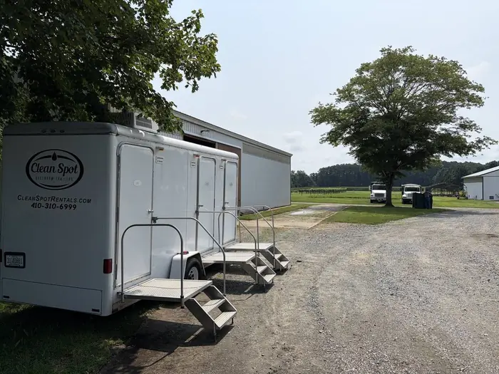 Clean Spot Rentals restroom trailer with the steps down, staged and ready for a Talbot County event