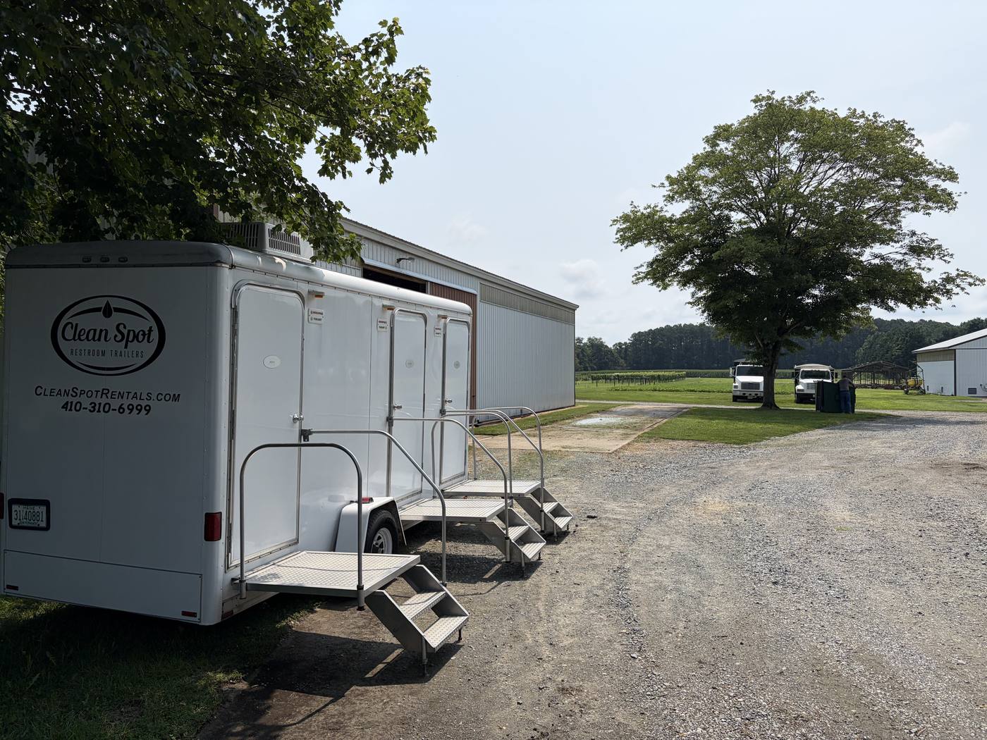 Clean Spot Rentals restroom trailer with the steps down, staged and ready for a Talbot County event