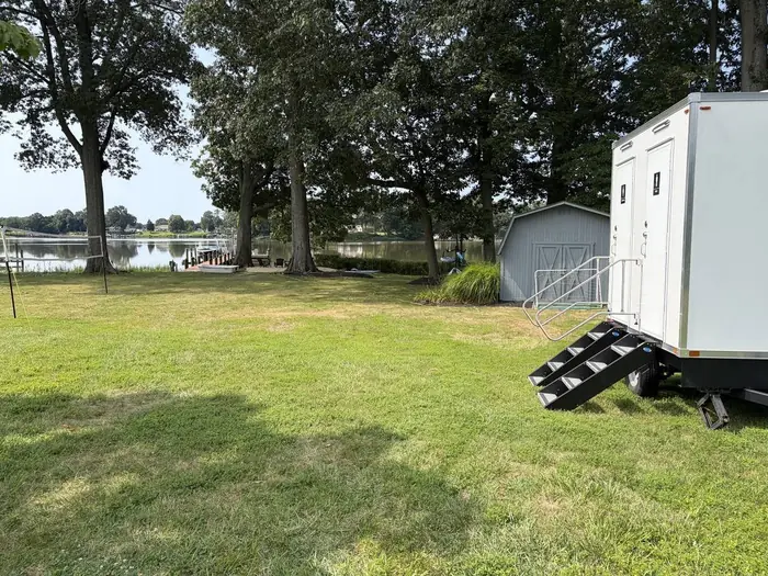 Luxury restroom trailer set up for a waterfront backyard wedding near St. Michaels, Maryland